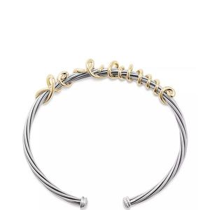 David Yurman ‘I love you’ whisper cable bracelet in silver and yellow gold.